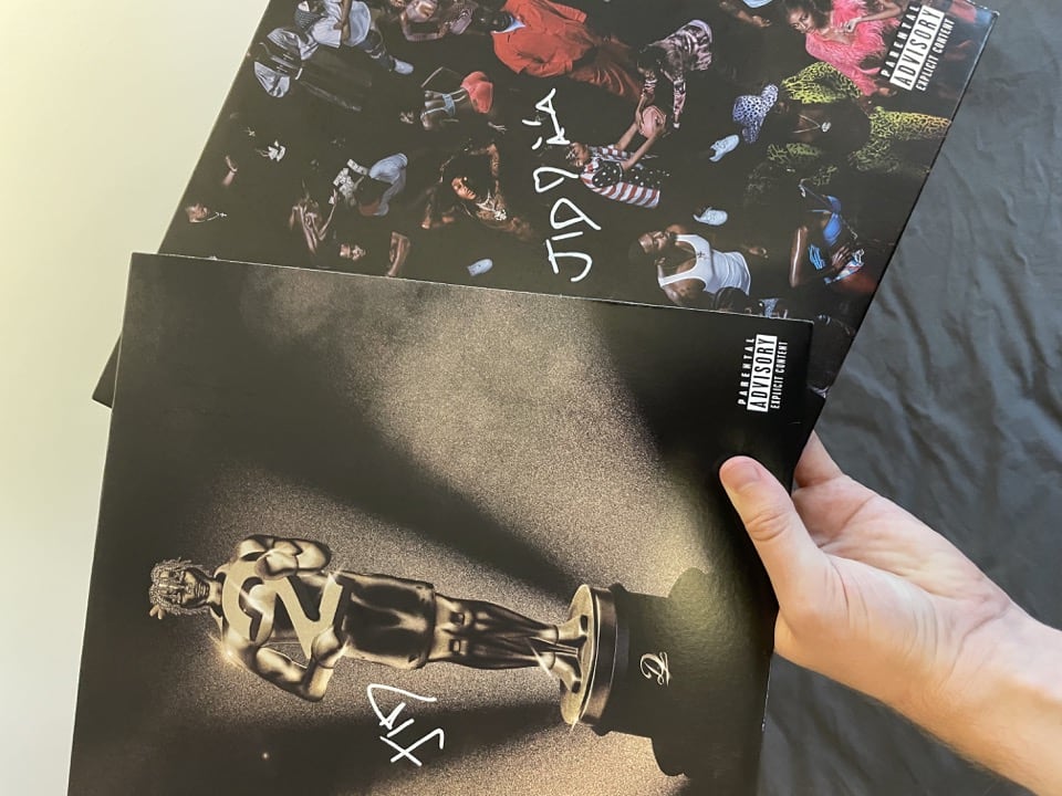 Record sleeves of "The Forever Story" and "DiCaprio 2" signed by JID